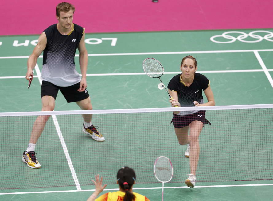 Russia's Alexandr Nikolaenko (L) and Valeria Sorokina play against China's Zhang Nan and Zhao Yunlei during their mixed doubles group play stage badminton match at the Wembley Arena during the London 2012 Olympic Games